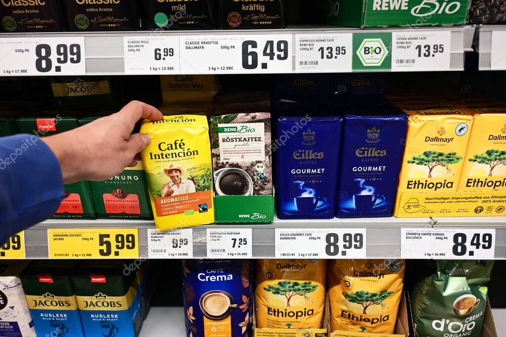 GERMANY - MAY 2025: Fair trade and Bio organic labeled coffee brands in a REWE Supermarket. Fair trade is an arrangement designed to help producers in developing countries achieve good trading.