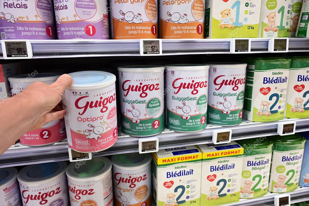 FRANCE - MAY 2025: Shelves with instant infant milk products in a E.Leclerc Hypermarket. Guigoz brand owned by multinationale Nestl. Bldina is a French food company specializing in baby food part of the Danone group.