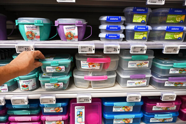 WALLONIA, BELGIUM - AUGUST 2023:Shelves with plastic kitchenware for sale in Carrefour Hypermarket. the brand name Sistema is a New Zealand manufacturer of versatile food storage containers.