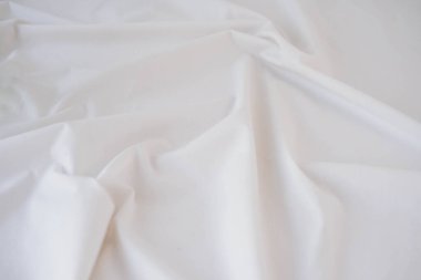Arka plan için beyaz kumaş dokusu. Arkaplan için soyut beyaz kumaş dokusu.