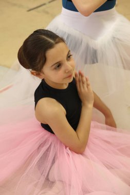 Young ballet dancer during rehearsals at the dance studio clipart