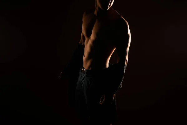 Silhouette of a handsome man\'s body in the studio