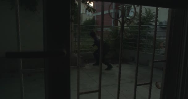 Burglar Opening Metal Door Crowbar Entering House Backyard — Stock Video