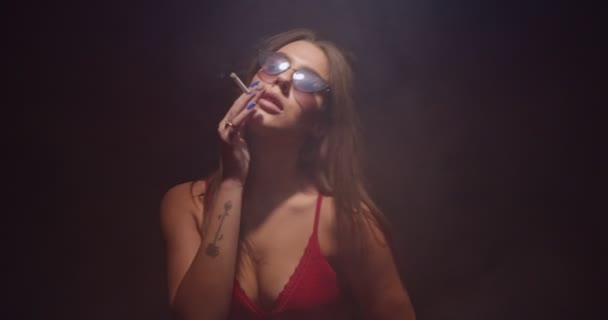 Cool Girl Dancing Seductively Smoking Wearing Red Lingerie Smoke Flowing — Stock Video