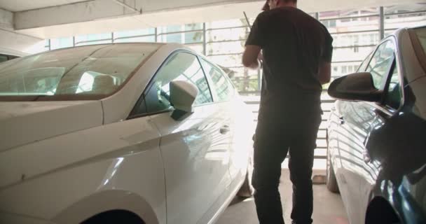 Thief Unlocking Car Public Garage Entering — Video