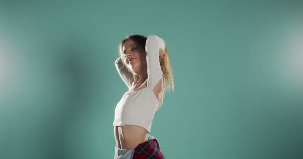 Trendy Girl Dancing Isolated Blue — Stock Video