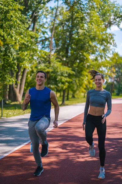 Two Adult Fitness Models Running Park — Stock Photo, Image