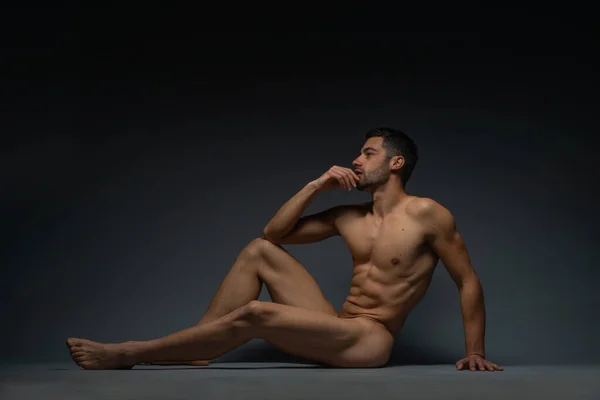 Fashion Nude Photo Male Model Seductive Figure Sitting Isolated Floor — Stock Photo, Image