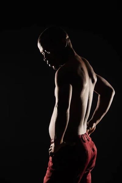 stock image Silhouette of handsome black male is posing in studio