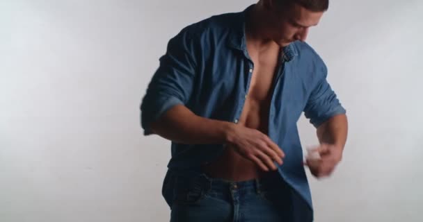 Handsome Man Adjusting Shirt Studio Isolated — Video