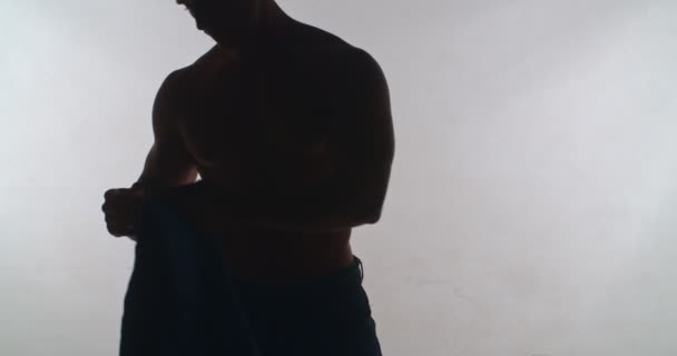 Man Putting Shirt Isolated Studio — Video