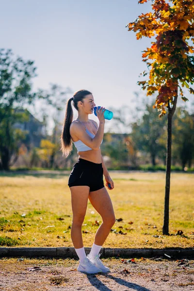 Tired Female Runner Drinking Water Training Park All Day Side —  Fotos de Stock