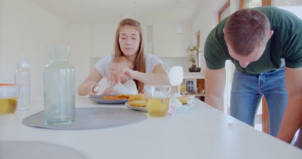 Beautiful Mother Changing Lunch Plates Sitting Dining Table Her Husband — Stockvideo