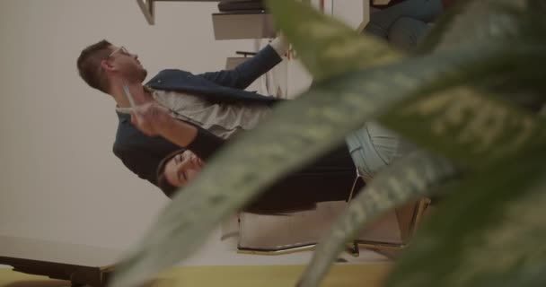 Two Young Colleagues Working Together Modern Office Space Vertical Video — Stockvideo