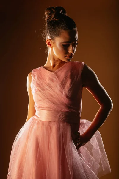 Photo Girl Looking Posing Pink Dress Her Left Hand Spine —  Fotos de Stock