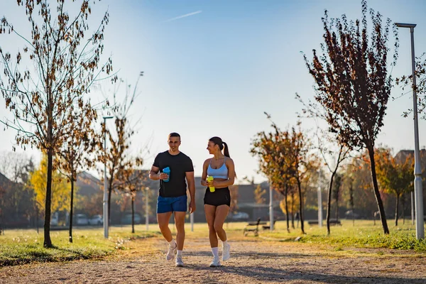 Attractive Couple Walking Having Fun Working Out Park Holding Bottles — Foto de Stock