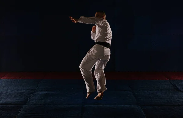 Handsome Young Man Black Belt Doing One Karate Pose Jumping — Stock Photo, Image