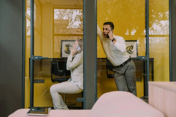 Two Attractive Male Female Coworkers Having Phone Call Phone Booths — Photo