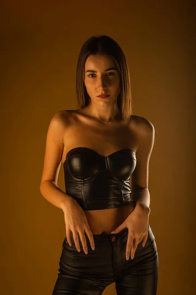 Girl Black Leather Top Pants Seductively Looking Posing Studio Beige — Stock Photo, Image