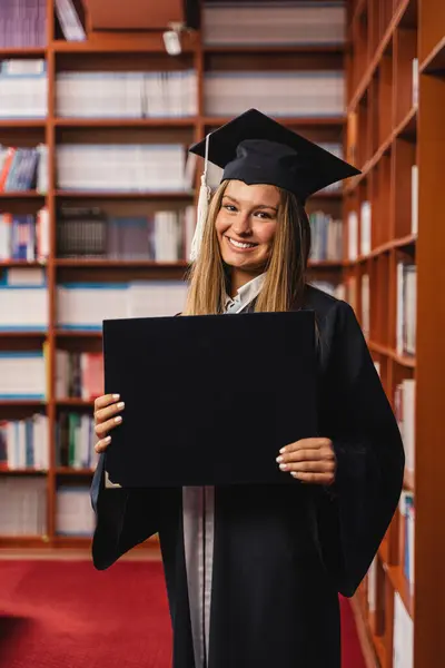 Young Pretty Excited Girl Holding Her Bachelor Degree While Smiling — Stock Photo, Image