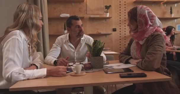 Three Business Diverse People Sitting Together Cafe Bar Discussing Being — Stock Video