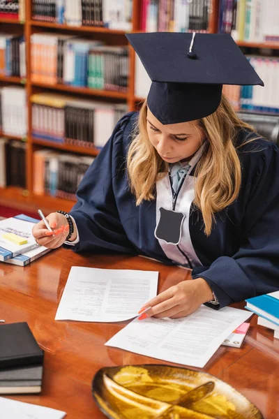University Graduate Wearing Cap Gown Signing Document Desk Library — Stock Photo, Image