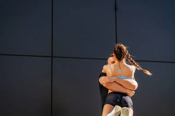 Hugged Sporty Couple Strong Fit Man Lifted His Girlfriend Spinning — Stock Photo, Image