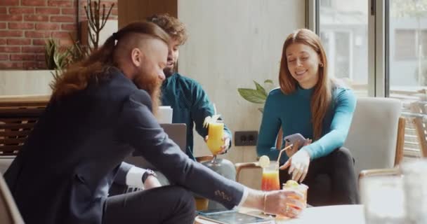 Three Colleagues Raising Glasses Celebrate Success Together Cafeteria Teal Orange — Stock Video