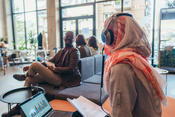 Multicultural Multiracial Employees Discussing Work Female Employee Wearing Hijab Reading — Stock Photo, Image