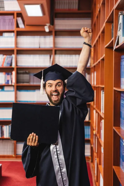 Thrilled University Graduate Celebrating Getting His Bachelor Degree Library — Stock Photo, Image