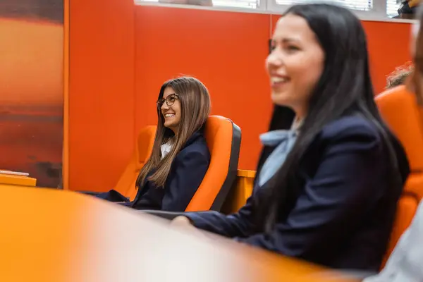 Two Beautiful Female Students Smiling While Listening Lecture Lecture Hall — Stock Photo, Image
