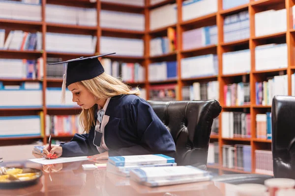 Young Beautiful Female Graduation Student Writing Her Personal Information Sheet — Stock Photo, Image