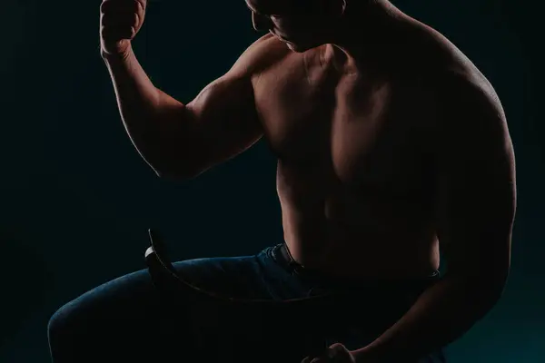 Male Shirtless Fitness Instructor Sitting Chair Showing His Biceps Silhouette — Stock Photo, Image