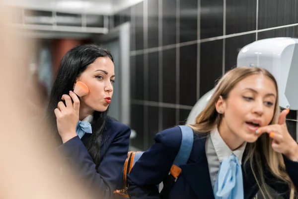 Beautiful College Students Applying Face Powder Lipstick Break Restroom — Stock Photo, Image