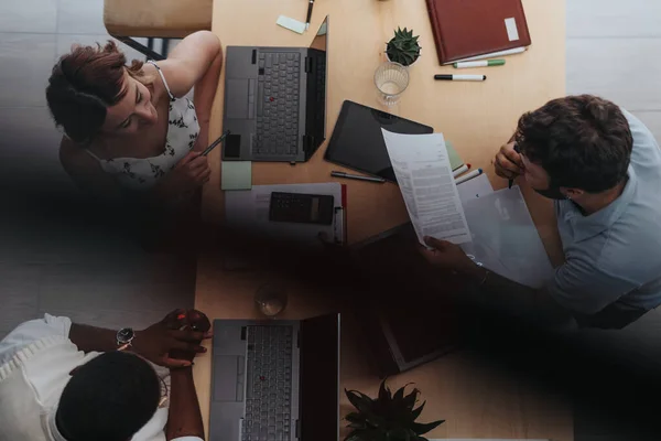 Discover a dynamic workspace where business employees collaborate, innovate, and drive growth. With diverse teams and modern technology, business strategies thrive. Above view photo.