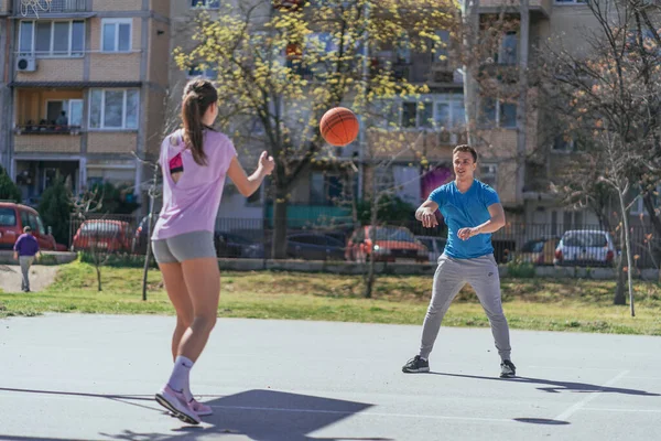Strong Male Passing Basketball Ball His Female Friend — Stock Photo, Image