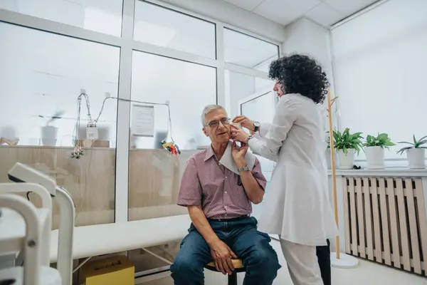 Experienced Physicians Checking Eyesight and Hearing in Clinical Setting