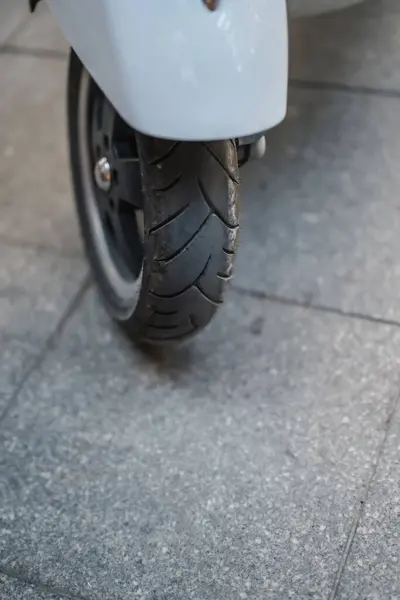 Close up shot of scooters wheel. Motorbike wheel.