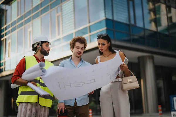 Adult Architects Engineers Discussing Blueprint Project Details Outdoors City Work — Stock Photo, Image
