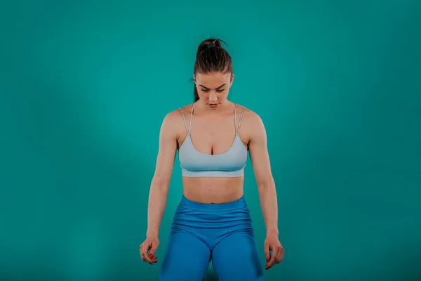 Confident Fit Woman Stretching Exercising Studio Turquoise Background — Stock Photo, Image