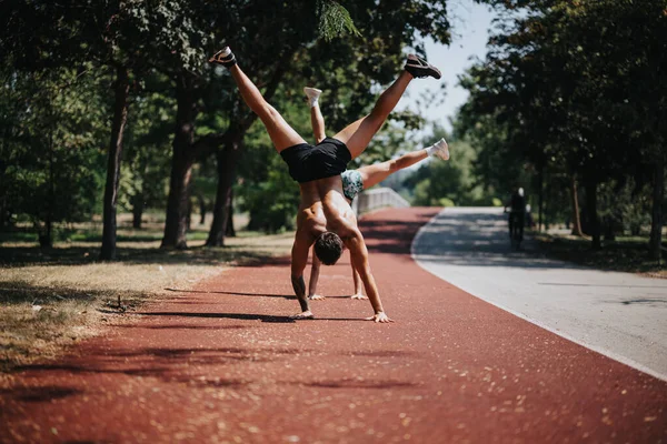 Fit Sportspeople Practice Cartwheel Sunny Park Inspiring Active Lifestyle Better — Stock Photo, Image