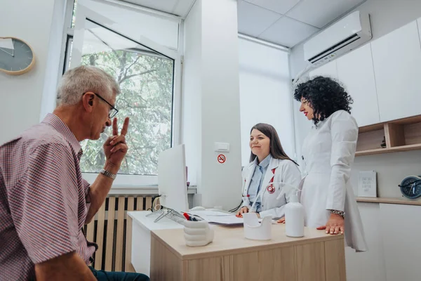 Professionals analyze diagnostic test results and provide successful treatment options in an indoor clinic. They focus on the physical and mental well-being of patients with various health problems.