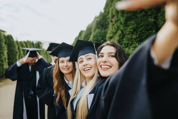 Happy College Graduates Gowns Caps Celebrating Milestones Outdoors Take Photos — Stock Photo, Image