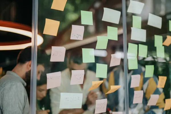Businesspeople Diverse Corporate Office Brainstorm Ideas Collaborating Writing Sticky Notes — Stock Photo, Image