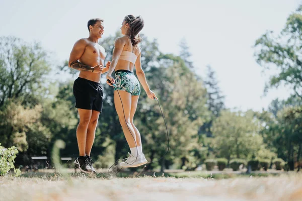 Caucasian Couple Friends Exercise Park Jumping Rope Training Together Outdoors — Stock Photo, Image