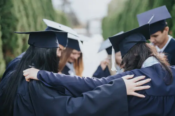 Graduating Students Celebrate Achievement Hugging Smiling Park Diverse Group Graduation — Stock Photo, Image