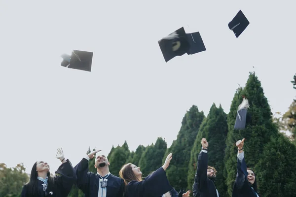 University Students Donning Graduation Gowns Caps Celebrate Academic Success Sunny — Stock Photo, Image