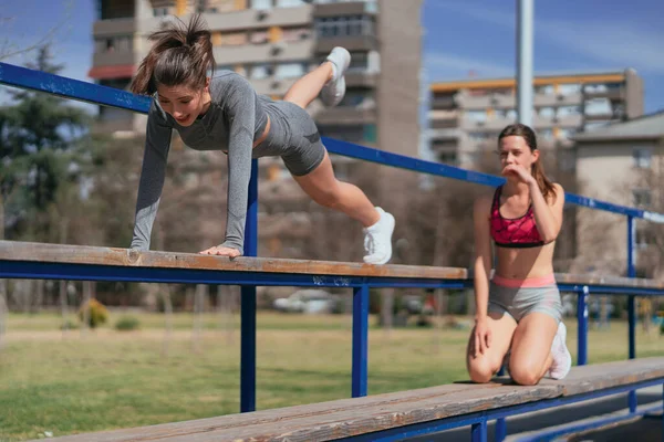 Gorgeous Girl Sportswear Almost Failed Bench Her Friend Looking Her — Stock Photo, Image