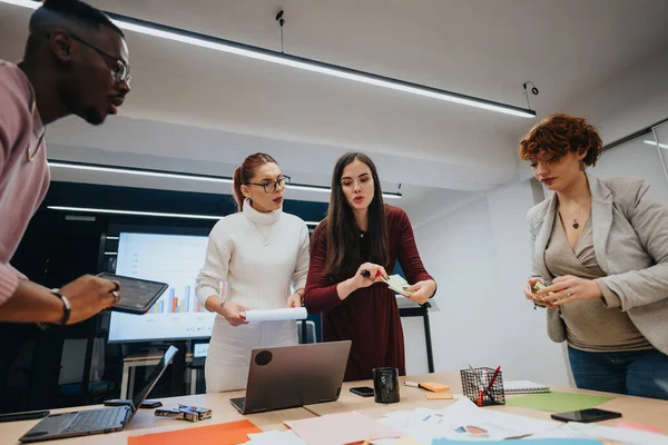 A multicultural group of businesspeople attending a dynamic workshop, collaborating and sharing ideas for successful strategic planning and innovative business strategies.