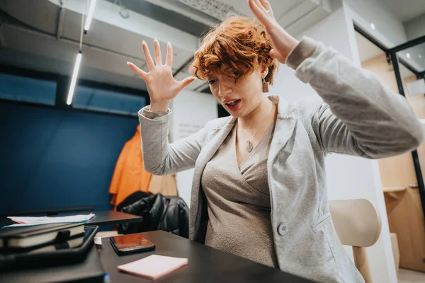 Business woman gestures anger. She is mad at herself after she did a mistake at her daily tasks at work.